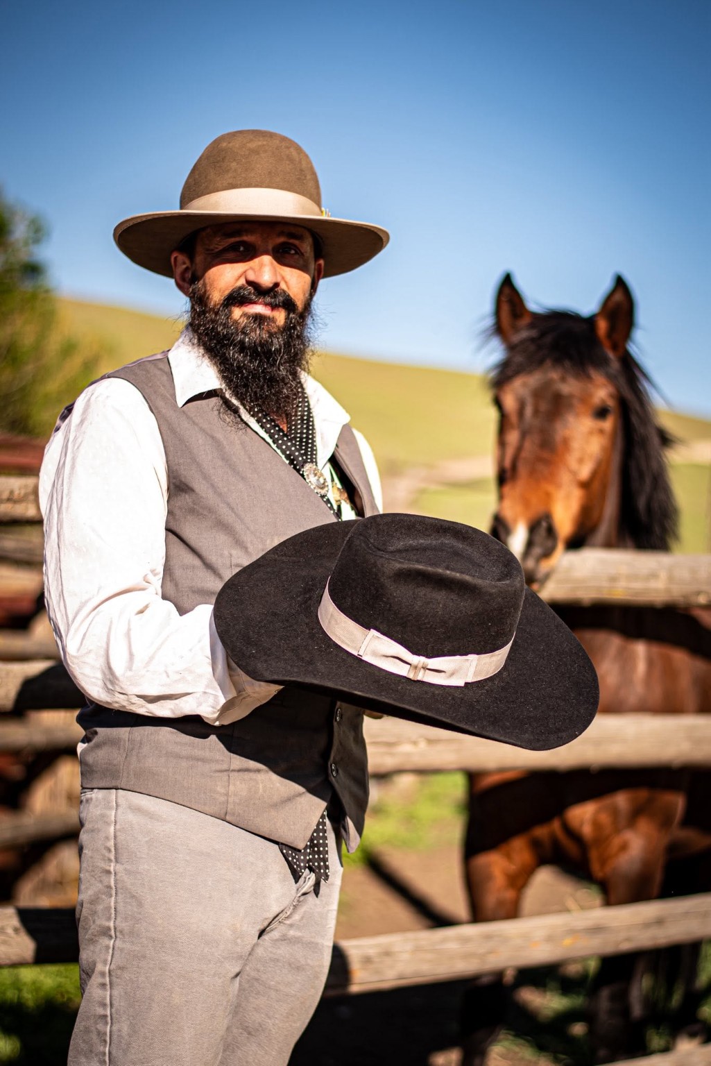 Josh Beesley holding a finished Snake River hat